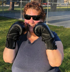 Photo of woman training with boxing gloves